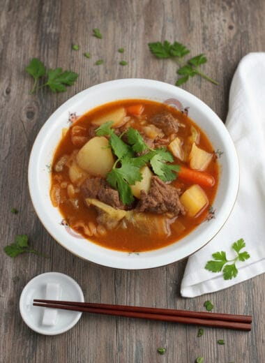 Bowl of vegetables beef soup with tender beef and fresh vegetables