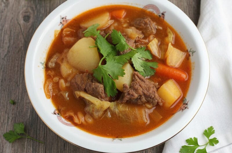 Bowl of vegetables beef soup with tender beef and fresh vegetables