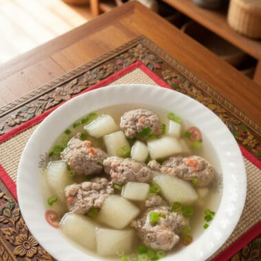 Bowl of Winter Melon Soup with Pork on a wooden table