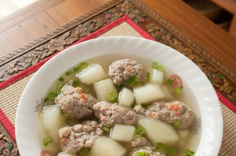 Bowl of Winter Melon Soup with Pork on a wooden table