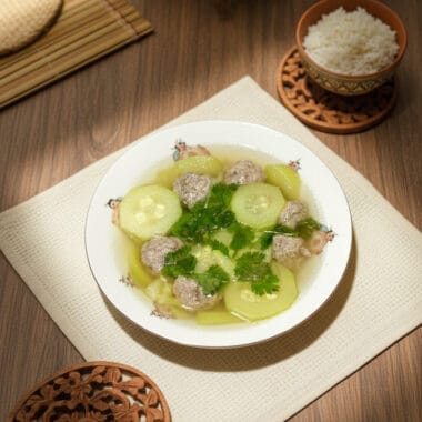 Khmer zucchini soup with grounded pork in a ceramic bowl