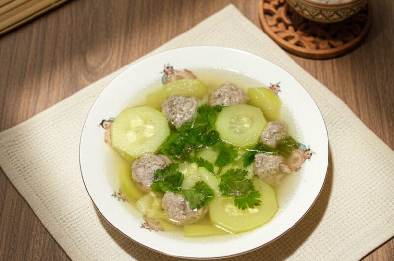 Khmer zucchini soup with grounded pork in a ceramic bowl