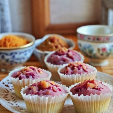 Chinese Sweet Potato Coconut Huat Kueh – fluffy steamed rice cakes made with purple sweet potato and topped with shredded coconut