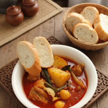 Traditional Khmer red chicken curry in a bowl