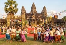 Cambodian families playing traditional games during Angkor Sankranta Khmer New Year celebrations in front of Angkor Wat temple