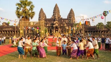 Cambodian families playing traditional games during Angkor Sankranta Khmer New Year celebrations in front of Angkor Wat temple