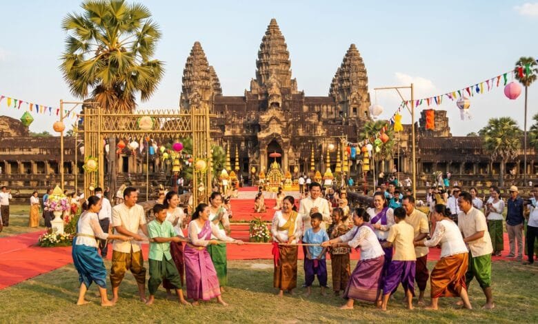 Cambodian families playing traditional games during Angkor Sankranta Khmer New Year celebrations in front of Angkor Wat temple