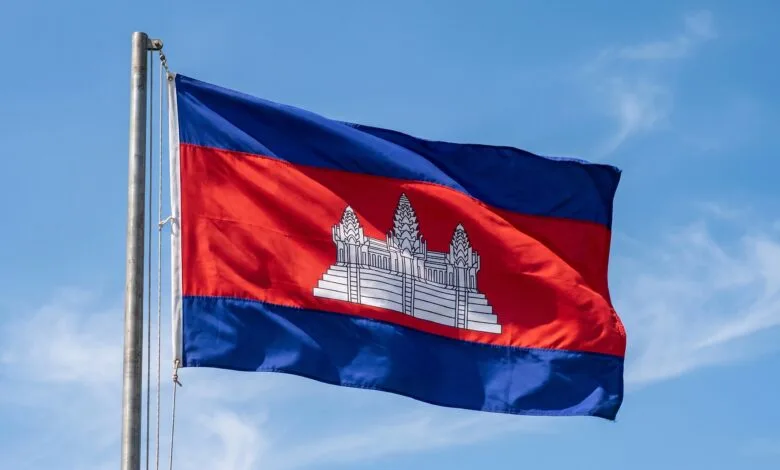 Cambodia's national flag with blue and red horizontal stripes and a white Angkor Wat temple in the center
