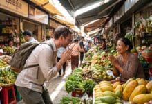 A foreign traveler greets a Cambodian market vendor with hands pressed together in the traditional sampeah gesture