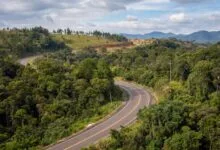 Rolling green hills and forested highland landscape near Sen Monorom in Mondulkiri province, Cambodia
