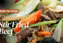Sizzling Cambodian stir-fried beef cooking in a hot wok