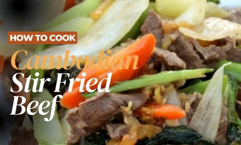 Sizzling Cambodian stir-fried beef cooking in a hot wok